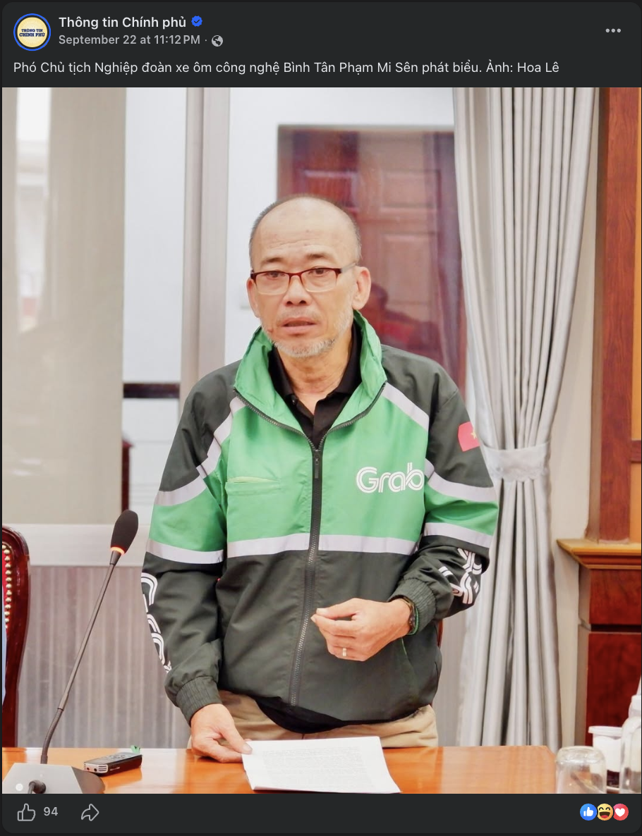 Facebook post from Thong tin Chinh phu, Sept 22 2026: Pham Mi Sen, Vice Chair of the Binh Tan Tech Motorbike-Taxi Union, speaking at an official meeting while wearing a Grab jacket